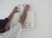 Tattoo nach und nach an die Wand kleben